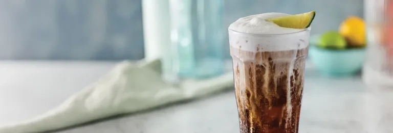 Coconut Coca-Cola Fizzy Soda with cold foam